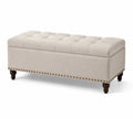 Panca contenitore imbottita in tessuto beige con gambe in legno