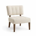 Sedia lounge in tessuto bouclé con gambe in legno